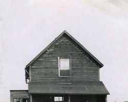 Frederick Allett and his bride Ivy posing in front of their company home around 1920s. The Alletts immigrated here from Lincolnshire in search of better employment. Home