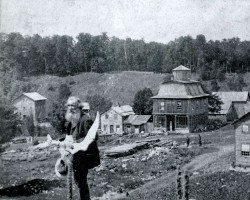 R. McLean Purdy, mill owner, store keeper, postmaster and collector of animal horns. His store was the large building in the centre. The Hogg store is located to the right. Store owner
