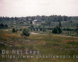 Facing southwest. The schoolhouse is in the lower right Town view