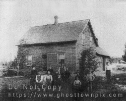 The Ebenezer Watkinson home with family members grouped in front. ca. late 1800s, early 1900s Family group